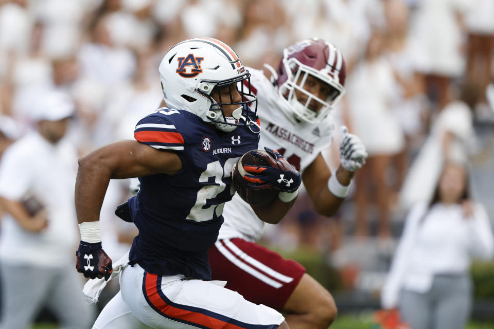 Auburn running back Jeremiah Cobb (23) carries the ball for a touchdown against Massachusetts during the second half of an NCAA college football game Saturday, Sept. 2, 2023, in Auburn, Ala. (AP Photo/Butch Dill)