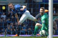 Everton's midfielder James McCarthy (L) scores past Manchester United's goalkeeper David de Gea during the English Premier League football match Everton vs Manchester United at Goodison park in Liverpool on April 26, 2015