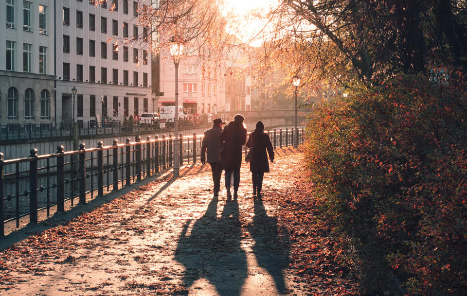 People Walking By Canal In City (Philipp Dase / EyeEm / Getty Images stock)