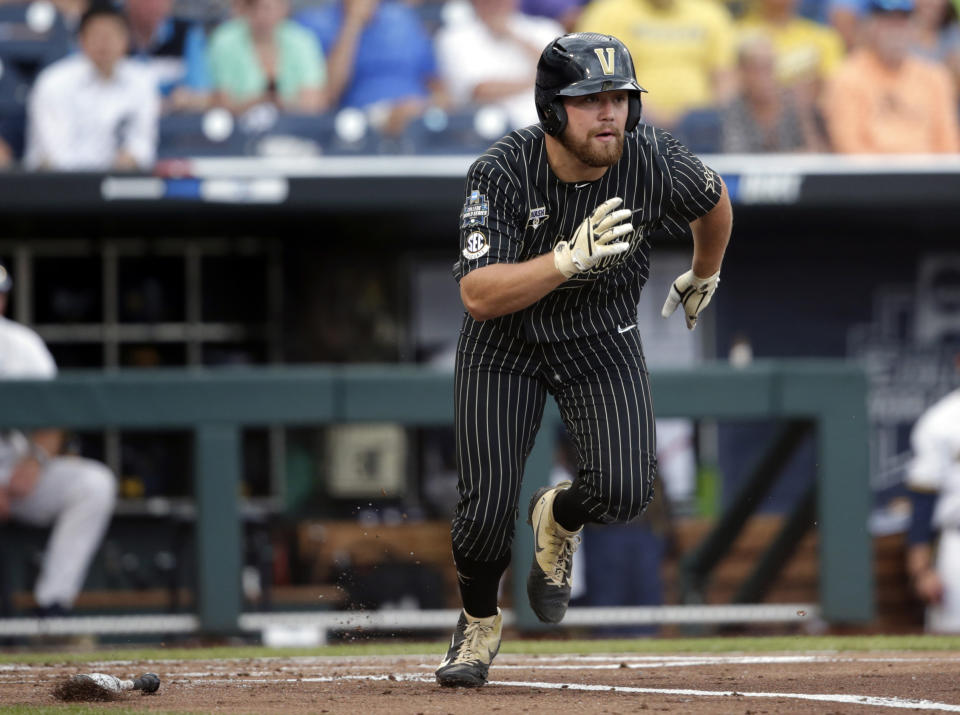 Vanderbilt's Stephen Scott runs off a base hit against Michigan in the second inning of Game 2 of the NCAA College World Series baseball finals in Omaha, Neb., Tuesday, June 25, 2019. (AP Photo/Nati Harnik)