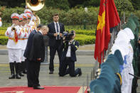 Vietnamese President To Lam, center left, and his Russian counterpart Vladimir Putin, center right, review the guard of honor at the Presidential Palace in Hanoi, Vietnam, Thursday, June 20, 2024. (AP Photo/Minh Hoang)