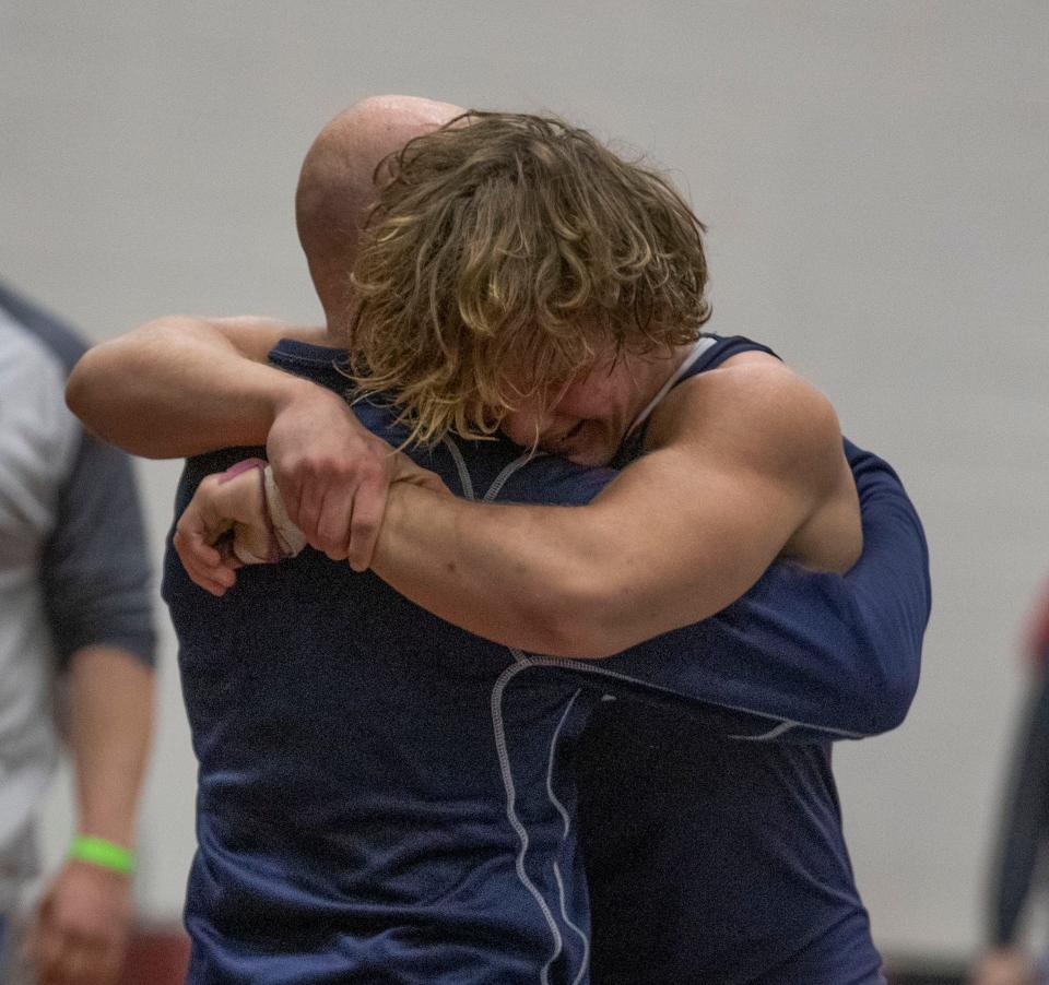 Howell's Hunter Mays (right), shown hugging Howell head coach John Gagliano last April 25 after he won the NJSIAA 160-pound championship at Phillipsburg High School, will compete at 165 pounds this season.