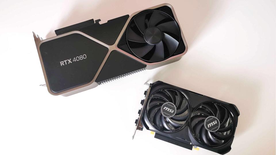 Nvidia RTX 4060 next to RTX 4080 on white surface