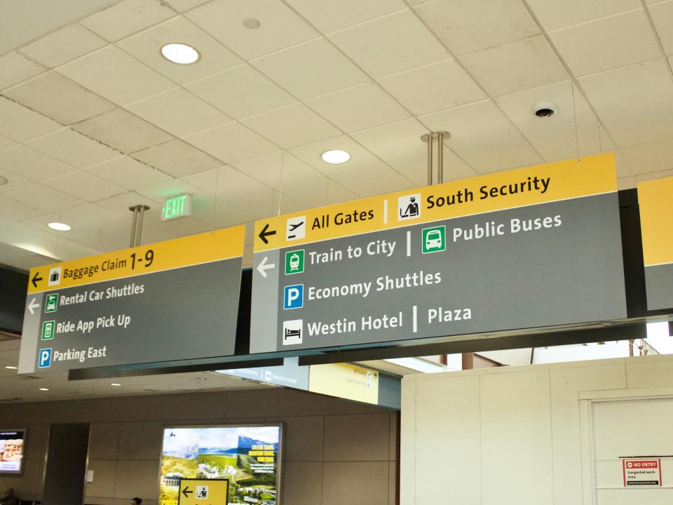 Signs in Denver airport leading to Westin Denver Airport Hotel.