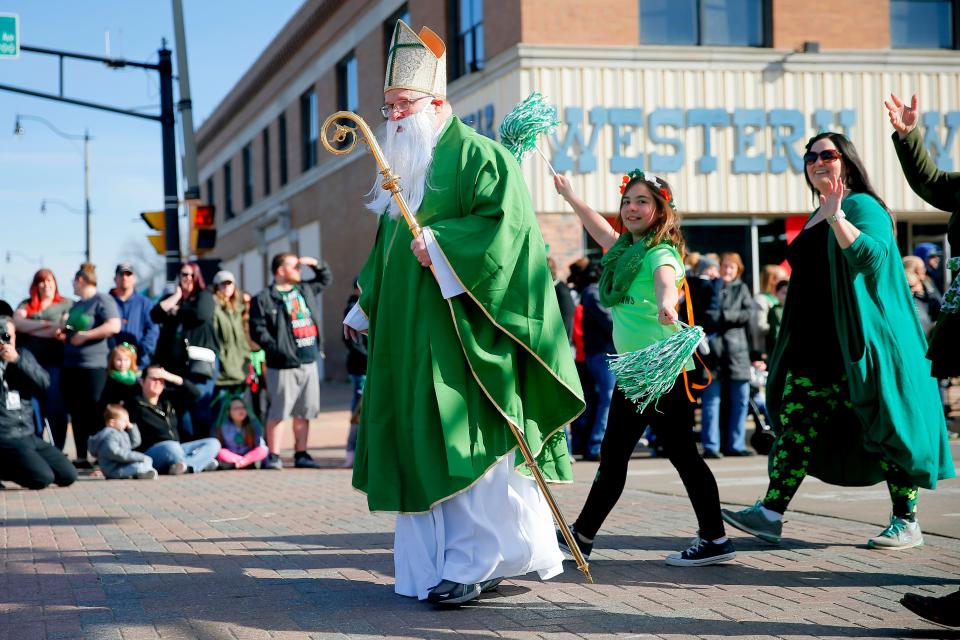 The Stockyards City St. Patrick's Parade will begin at 10 a.m. Saturday. In this photo, Pat Downes, plays the role of Saint Patrick with his granddaughter, Leah Goodale, and his daughter, Kirstin Goodale, during a previous year's parade.