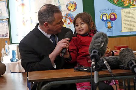 Ex-soldier Rob Lawrie attends a news conference with Afghani girl Bahar Ahmadi, known as Bru, in Boulogne-sur-Mer, France, January 14, 2016. REUTERS/Benoit Tessier