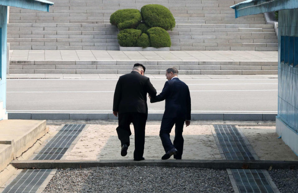 North Korean leader Kim Jong Un (left) and South Korean President Moon Jae-in shake hands over the military demarcation line upon meeting for the Inter-Korean Summit on 27 April, 2018, in Panmunjom, South Korea. (Getty Images file photo)