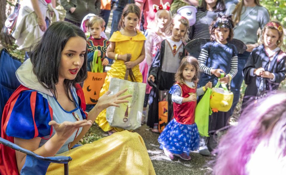 Snow White, played by Lilly Foster, shares her tale Saturday on the Trick or Treat Trail at RCA Community Park in 2019.