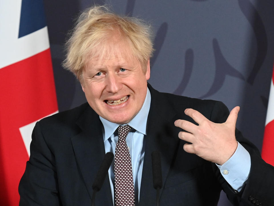 Britain's Prime Minister Boris Johnson speaks during a media briefing in Downing Street, London, Thursday, Dec. 24, 2020. Britain and the European Union have struck a provisional free-trade agreement that should avert New Year's chaos for cross-border commerce and bring a measure of certainty to businesses after years of Brexit turmoil. The breakthrough on Thursday came after months of tense and often testy negotiations that whittled differences down to three key issues: fair-competition rules, mechanisms for resolving future disputes and fishing rights. (Paul Grover/Pool Photo via AP)