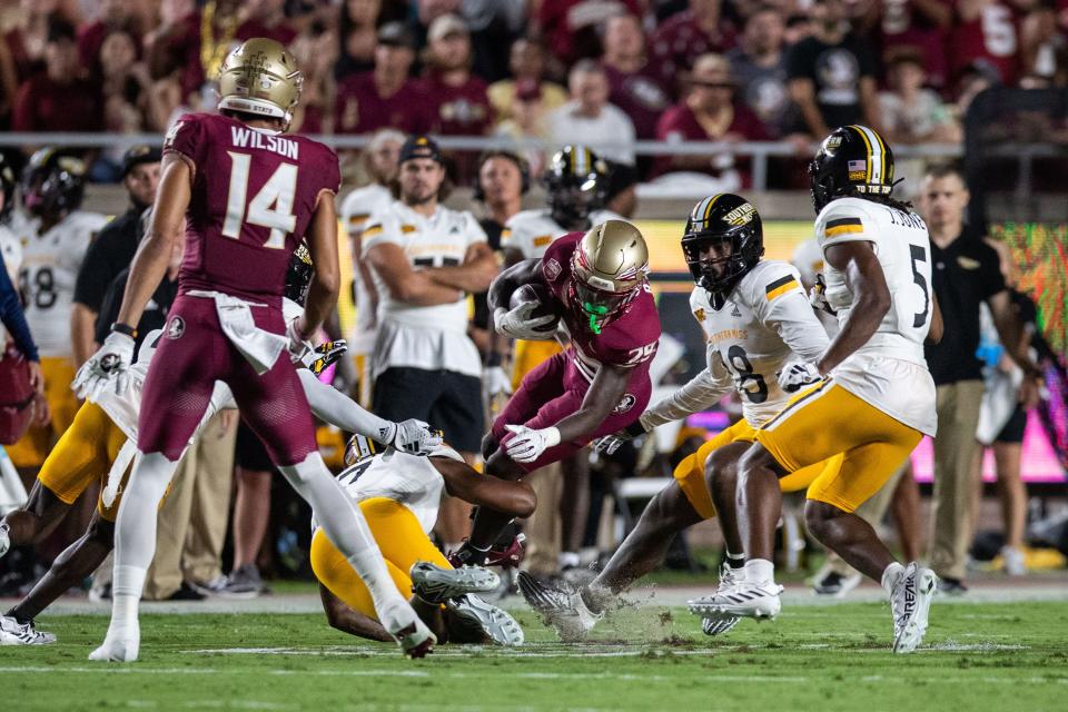 Florida State Seminoles running back Rodney Hill (29) dives over defenders. The Florida State Seminoles defeated the Southern Miss Golden Eagles on Saturday, Sept. 9, 2023.
