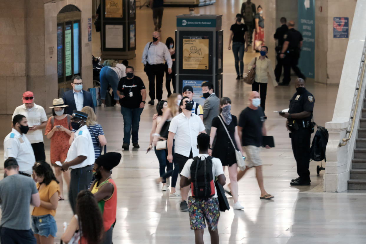 People wear masks in Grand Central Terminal in New York City on July 27. (Spencer Platt/Getty Images)