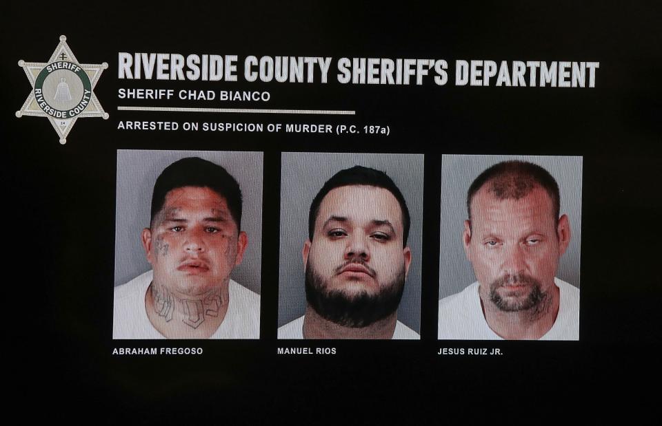 A screen displays the mugshots of those arrested on the suspicion of murder of victims Jonathan Reynoso and Audrey Moran during a Sheriff's Department press conference in Palm Desert, June 30, 2020.
