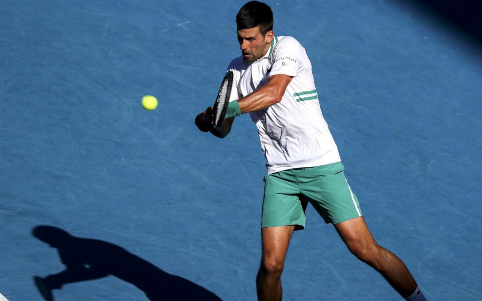 Novak Djokovic of Serbia in action against Frances Tiafoe