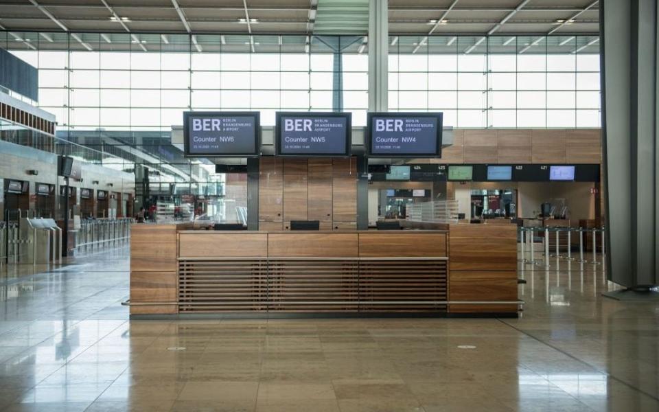 An empty counter at the new BER airport in Berlin, which was designed to see 20 million passengers a year pass through it - Getty Images