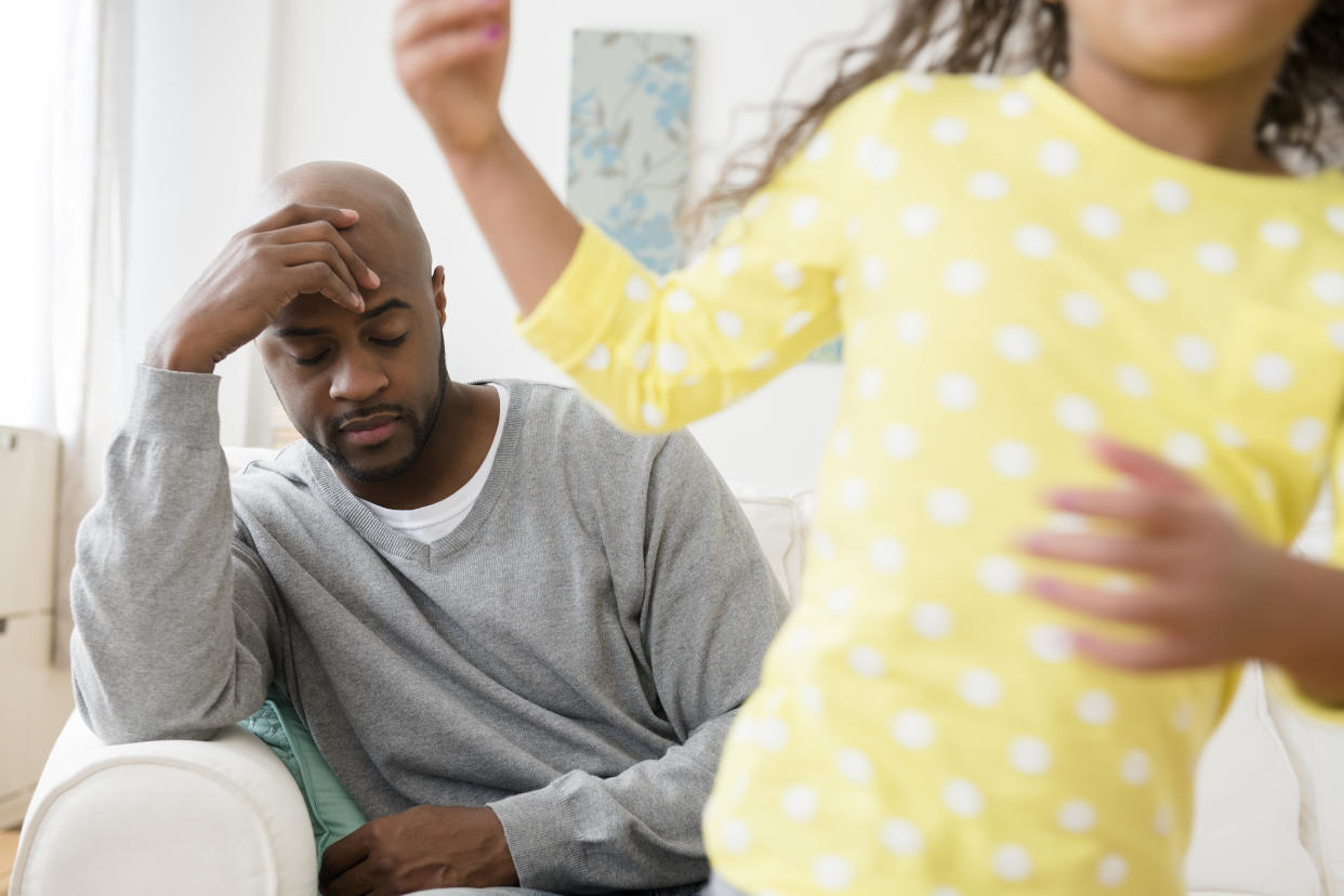 Tired parent looking after child (Getty Images)