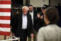 Democratic presidential candidate Sen. Bernie Sanders, I-Vt., center, smiles as he is introduced by Rep. Alexandria Ocasio-Cortez, D-N.Y., right, during a campaign event Saturday, Jan. 25, 2020, in Marshalltown, Iowa. (AP Photo/Marcio Jose Sanchez)