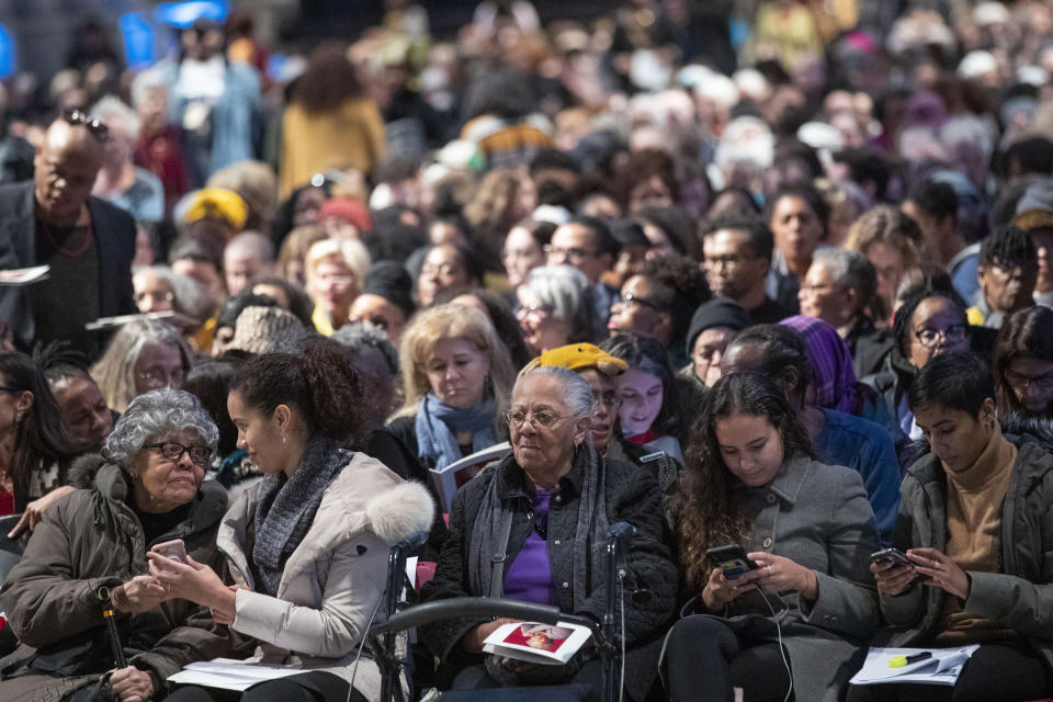 Mourners congregate before the start of the Celebration of the Life of Toni Morrison, Thursday, Nov. 21, 2019, at the Cathedral of St. John the Divine in New York. (AP Photo/Mary Altaffer)