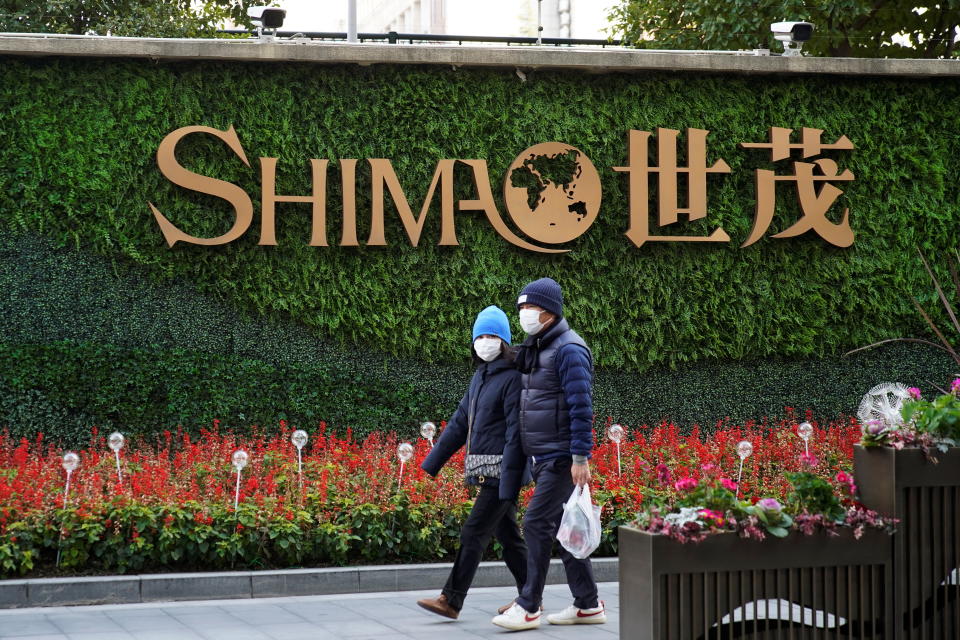UOB sues distressed China property developer Shimao over loan terms.