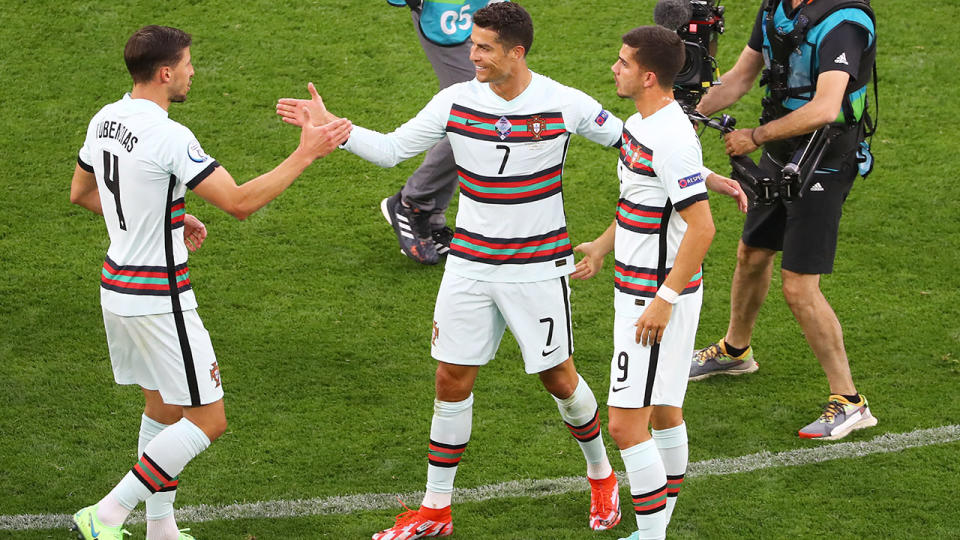Cristiano Ronaldo, pictured here celebrating with teammates after Portugal beat Hungary at Euro 2020.