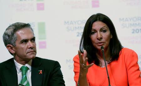 Paris Mayor Anne Hidalgo (R) speaks next to Mexico City's Mayor Miguel Angel Mancera during a news conference as they attend at the C40 Mayors Summit, in Mexico City, Mexico, November 30, 2016. REUTERS/Henry Romero