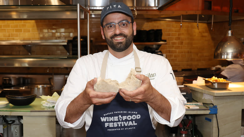 Alon Shaya holding pita bread