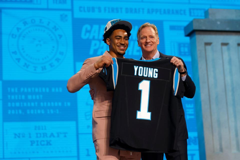 Bryce Young, left, poses with NFL Commissioner Roger Goodell after being selected first overall by the Carolina Panthers during the first round of the 2023 NFL Draft at Union Station on April 27, 2023 in Kansas City, Missouri.