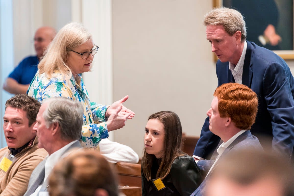 Lynn Murdaugh Goette, Alex Murdaugh's sister, speaks with John Marvin Murdaugh, standing, Brooklynn White and Buster Murdaugh, the son of Alex Murdaugh (AP)