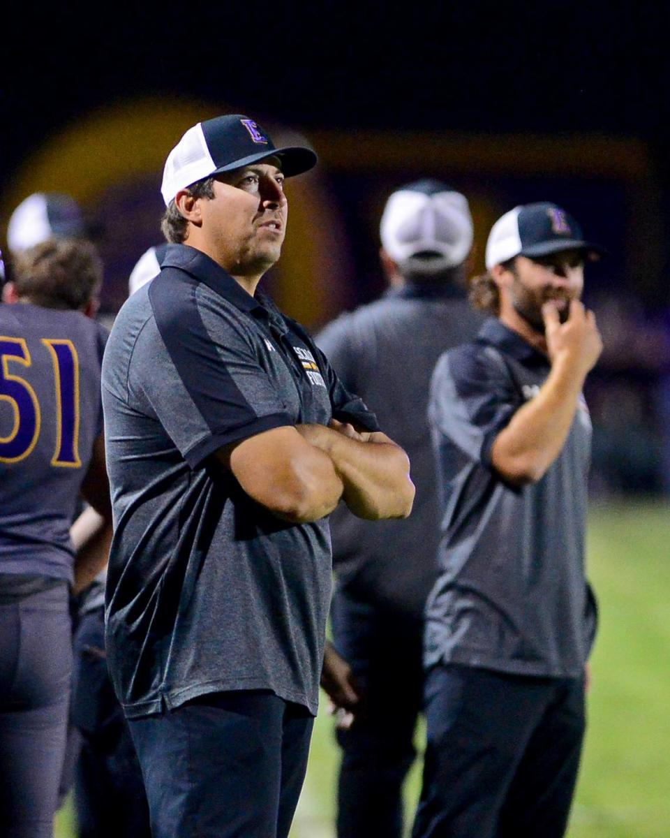 Escalon Head Coach Andrew Beam watches his team from the sidelines during a game between Escalon High School and Ripon High School in Escalon, California on October 20, 2023. 