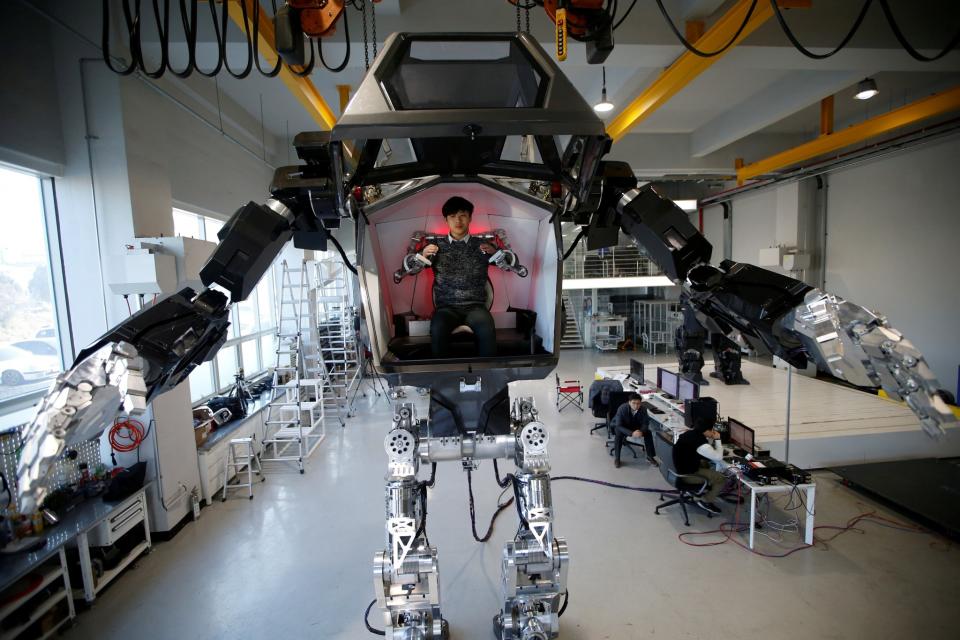 A manned biped robot walks during a demonstration in Gunpo, South Korea