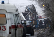 Members of the emergency services work at the site of a bomb blast on a trolleybus in Volgograd December 30, 2013. At least 10 people were killed when an explosion ripped through a trolleybus in the second deadly blast in the Russian city of Volgograd in two days, the Interfax news agency reported, citing law enforcement officials. REUTERS/Sergei Karpov (RUSSIA - Tags: CIVIL UNREST CRIME LAW DISASTER TRANSPORT)