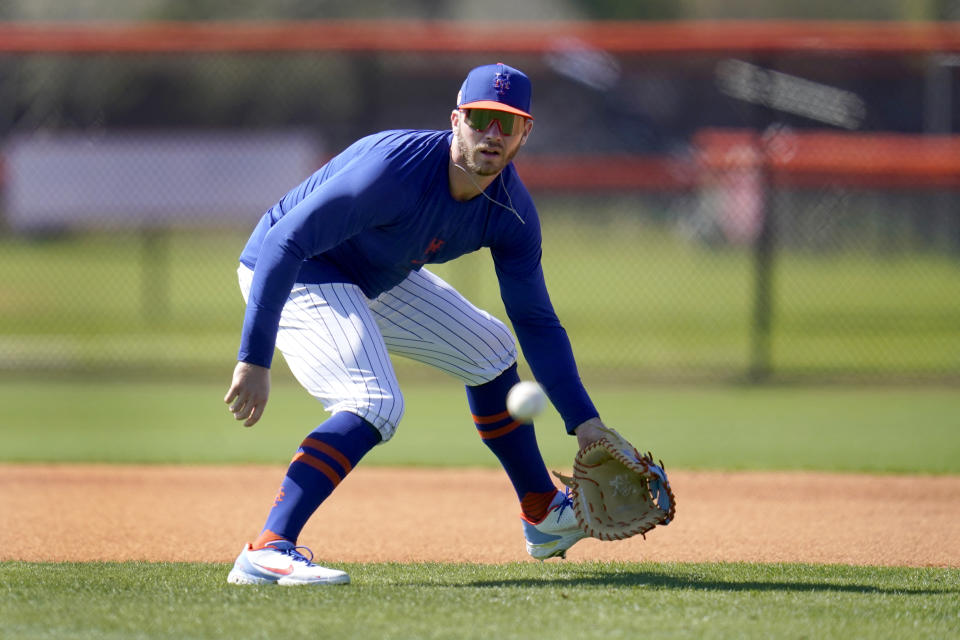 New York Mets infielder Pete Alonso handles a grounder during spring training baseball practice Tuesday, Feb. 23, 2021, in Port St. Lucie, Fla. (AP Photo/Jeff Roberson)