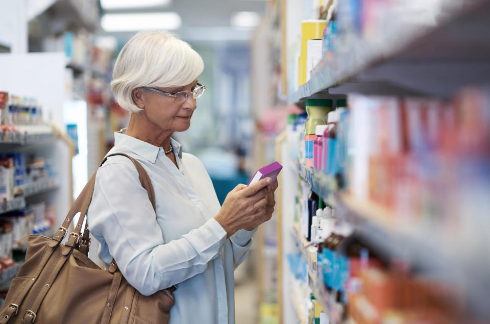 Shot of an elderly woman looking at products in a pharmacy