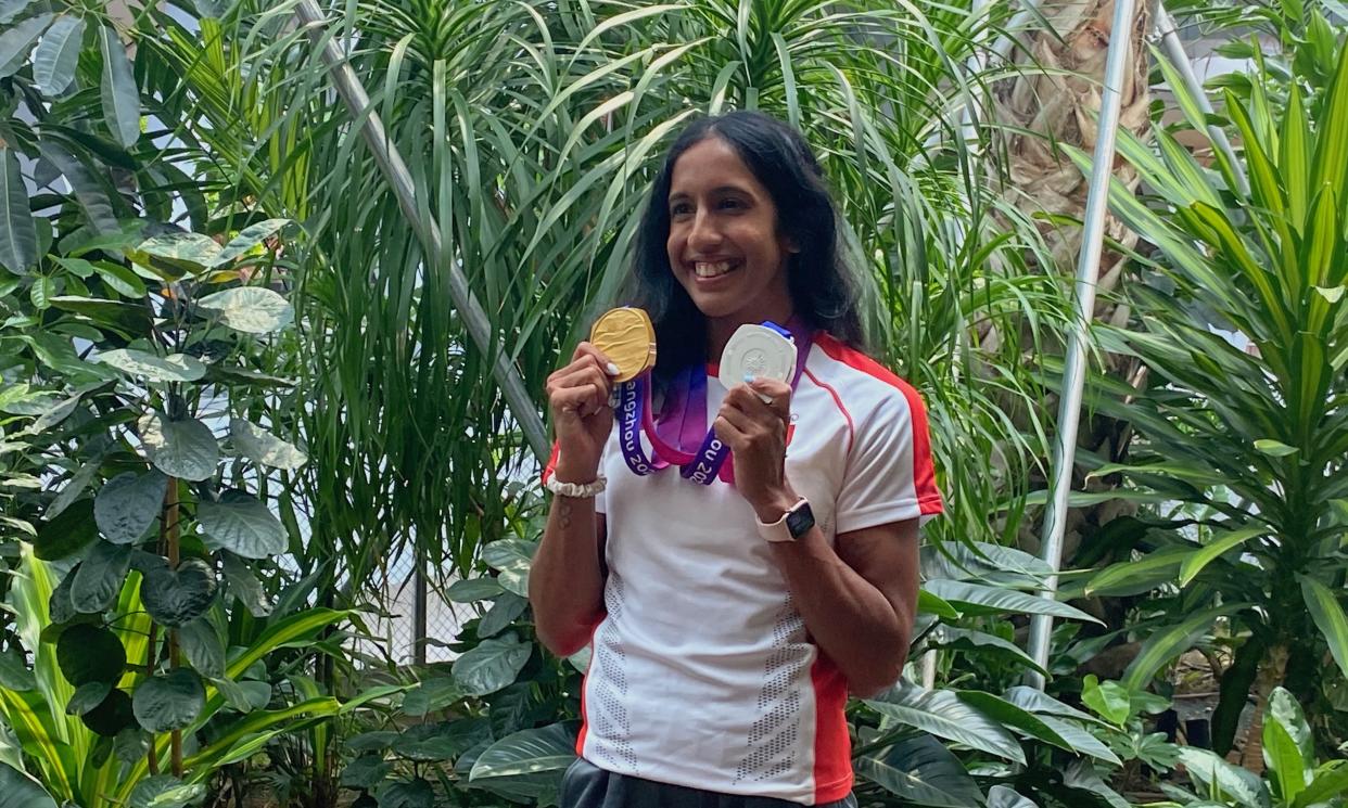 Sprinter Shanti Pereira poses with her gold and silver athletics medals as she returns to Singapore after the 2023 Hangzhou Asian Games. (PHOTO: Chia Han Keong/Yahoo News Singapore)