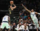 Charlotte Hornets guard James Bouknight, left, releases a jump shot during second half action against the Dallas Mavericks at Spectrum Center in Charlotte, NC on Sunday, March 26, 2023. The Charlotte Hornets defeated the Dallas Mavericks 110-104.