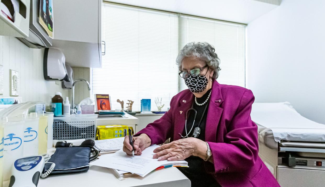 Dr. Barbara Hummel fills out paperwork at her office in Greenfield, WI. on Friday, Oct. 30, 2020. She has been serving patients in the Milwaukee area since 1995, however her practice has seen a dramatic decline in business due to the COVID-19 pandemic.