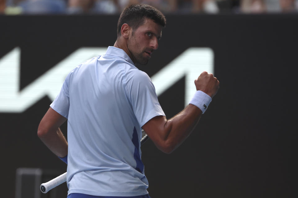 Novak Djokovic of Serbia reacts after winning the first set against Taylor Fritz of the U.S. during their quarterfinal match at the Australian Open tennis championships at Melbourne Park, Melbourne, Australia, Tuesday, Jan. 23, 2024. (AP Photo/Asanka Brendon Ratnayake)