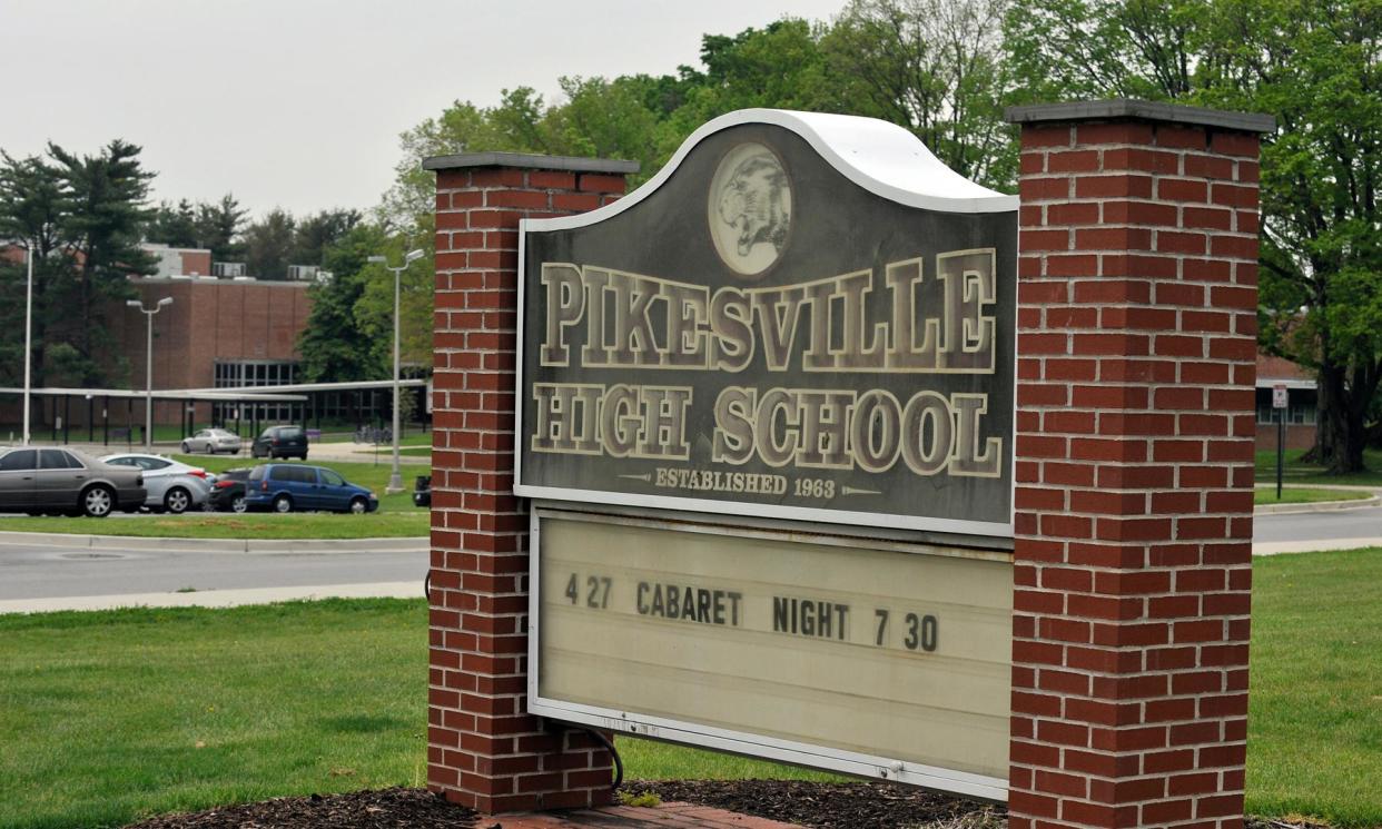 <span>The Pikesville high school sign on the school property. </span><span>Photograph: Lloyd Fox/AP</span>