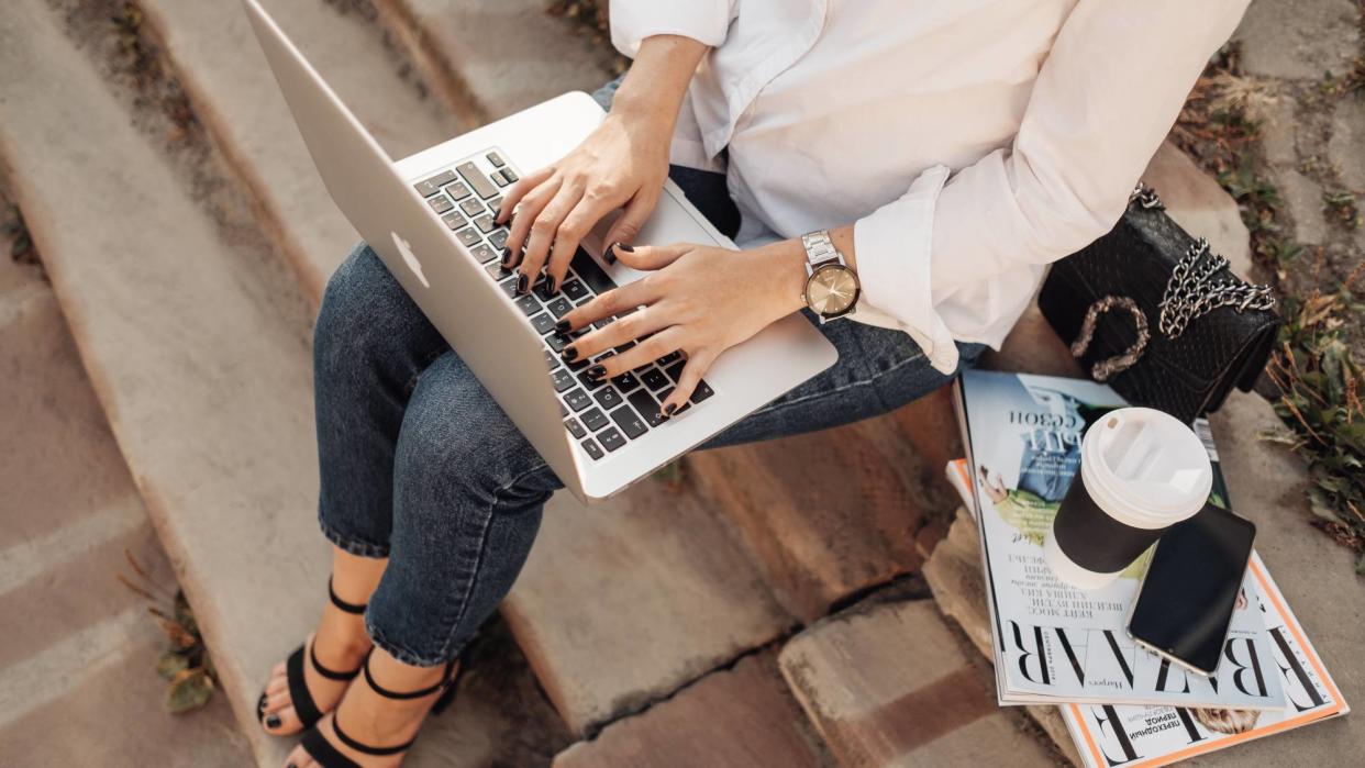  Fashionable Girl with Gucci Handbag Working on Apple Laptop Macbook Air 