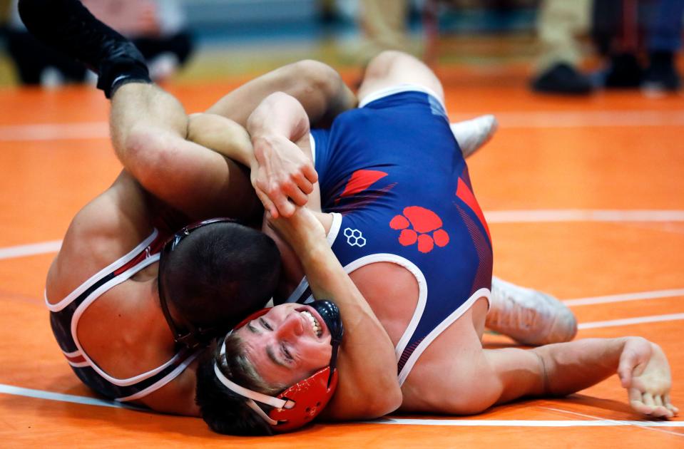 Eli Justice, left, of Newark, pins Licking Valley's Luke Conaway in the finals at 150 pounds during the Licking Valley Invitational on Saturday, Jan. 7, 2023, in Hanover, Ohio.