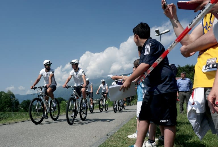 Germany football players ride bikes during a training session as part of the team's preparation for the upcoming Euro 2016 European football championships, in Ascona on May 27, 2016