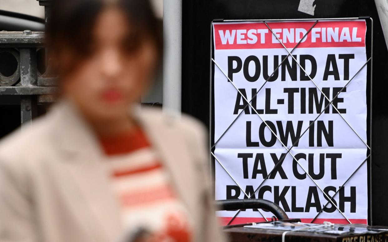  pedestrian walks past a news paper headline showing the fall in the British pound in London, Britain, 27 September 2022 - /Shutterstock/ ANDY RAIN/EPA-EFE
