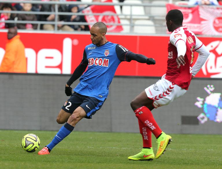 Fabinho (left) scores for Monaco against Reims on March 22, 2015 at the Auguste Delaune Stadium in Reims