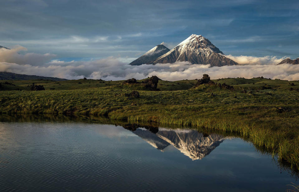 Stunning images capture ‘UFO’ clouds surrounding volcano 