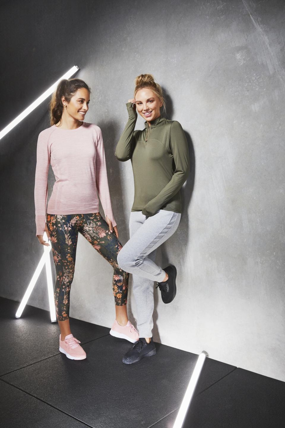 Two female models wearing long-sleeve tops and leggings from Aldi's activewear range