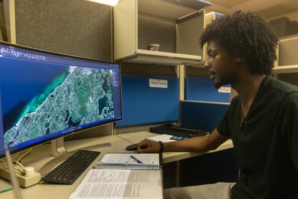 Tyvonta Johnson, 22, a college student from Baltimore, Maryland, works on his final project as part of the Woods Hole Partnership Education Program in Falmouth.
