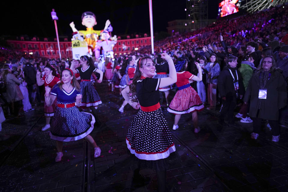 Dancers parade through Place Massena during the opening ceremony of 151st edition of the Nice Carnival in Nice, southern France, Saturday, Feb. 17, 2024. (AP Photo/Daniel Cole)