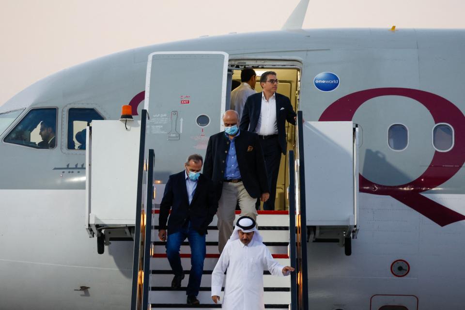 US citizens Siamak Namazi (back), Emad Sharqi (L) and Morad Tahbaz (C) disembark from a Qatari jet upon their arrival at the Doha International Airport in Doha on September 18, 2023. Five US detainees, three previously identified as Siamak Namazi, Morad Tahbaz and Emad Sharqi and two who wish to remain anonymous, released by Iran landed in Doha in a prisoner swap on September 18 after $6 billion in frozen funds were transferred to Iranian accounts in Qatar. (Photo by Karim JAAFAR / AFP) (Photo by KARIM JAAFAR/AFP via Getty Images)