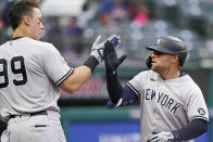 New York Yankees' Rougned Odor, right, is congratulated by Aaron Judge after Odor hit a solo home run in the fifth inning of a baseball game against the Cleveland Indians, Saturday, April 24, 2021, in Cleveland. (AP Photo/Tony Dejak)