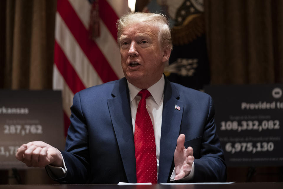 President Donald Trump speaks during a meeting with Arkansas Gov. Asa Hutchinson, and Kansas Gov. Laura Kelly, in the Cabinet Room of the White House, Wednesday, May 20, 2020, in Washington. (AP Photo/Evan Vucci)