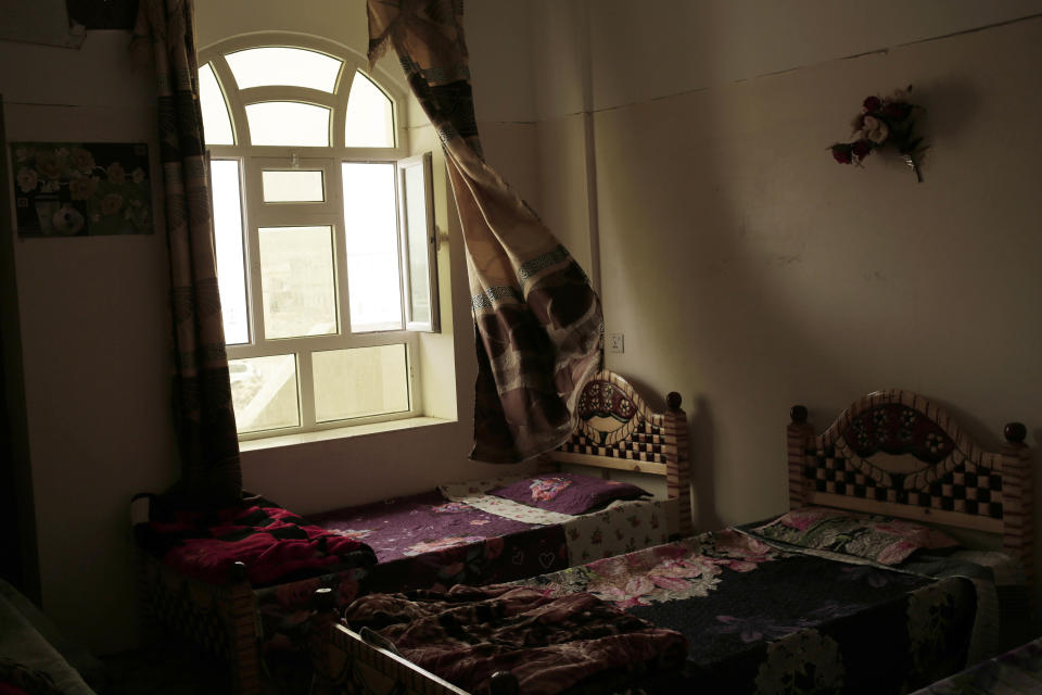 This July 28, 2018, photo shows a bedroom at the Rehabilitation Of Children Recruited and Impacted By War in Yemen Project center in Marib, Yemen. The Houthis have inducted 18,000 child soldiers into their rebel army since the beginning of the war in 2014, a senior Houthi military official acknowledged to The Associated Press. (AP Photo/Nariman El-Mofty)